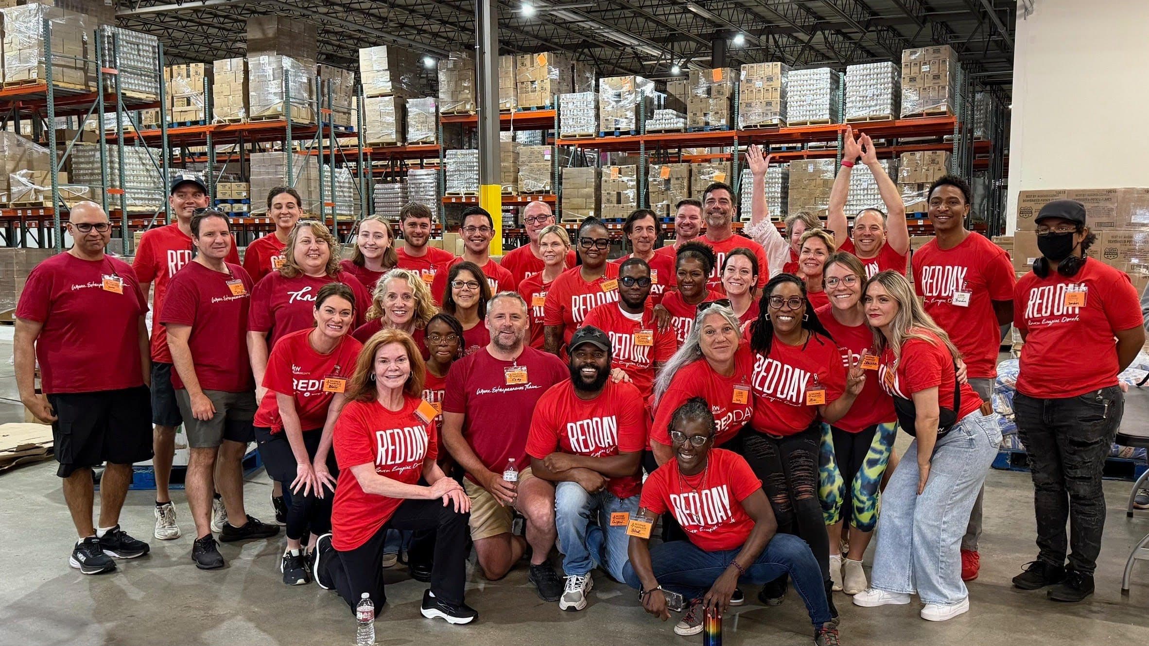 KWNO Shares RED Day volunteers gathered at a food distribution warehouse
